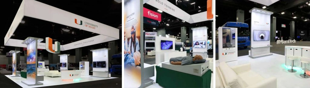 Exhibition booth of the University of Miami displaying interactive and technological exhibits showcasing the expertise of trade show exhibit builders in Miami.