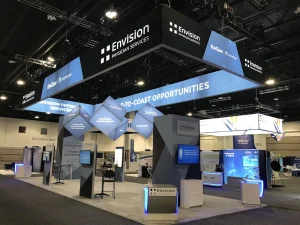 Trade show booth rental in Fort Lauderdale for Envision Physician Services with banners and digital screens.