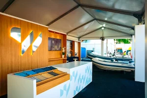 Miami International Boat Show 2025 featuring a logo, counter, and inflatable boats.