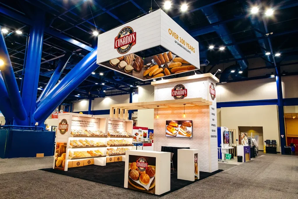 Cusano’s Baking Company 20x20 Trade Show Booth with hanging sign and bread displays.
