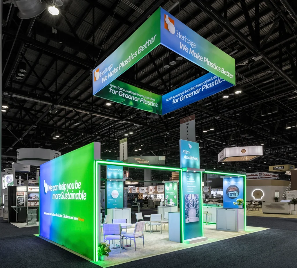 A vibrant 20 x 30 Trade Show Booth with green and blue lighting.