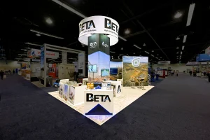 A custom island booth design for Beta Engineering at a trade show convention center.