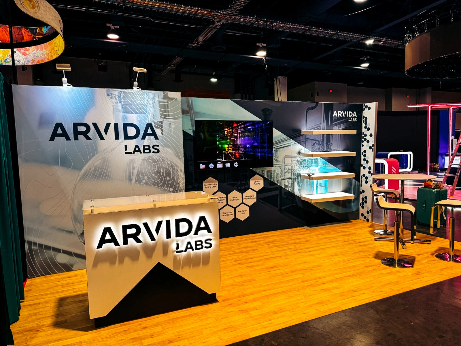 An Exhibit Crafts' portable display for trade shows featuring a modern Arvida Labs booth setup.