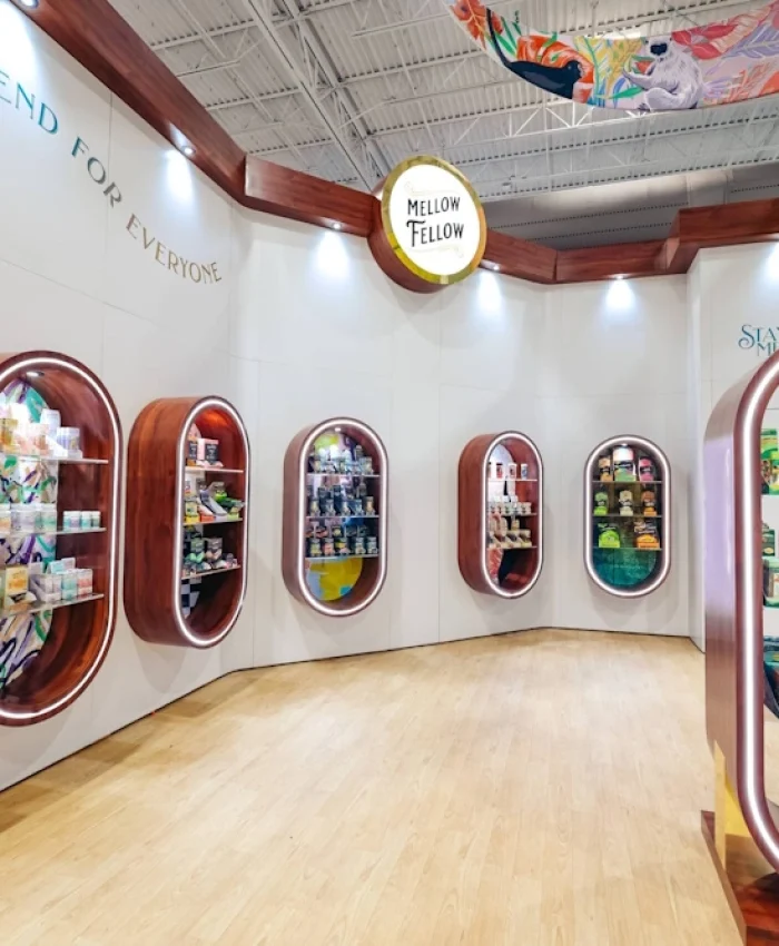 Trade show booth Fort Lauderdale for Mellow Fellow built by Exhibit Craft Trade show booths Fort Lauderdale showcasing Mellow Fellow with oval wooden display shelves